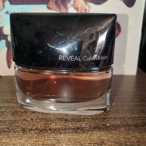 Calvin Klein Reveal with Black Cap and Clear Bottle
